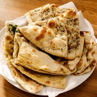 Naan Platter- (Garlic,Onion,Butter,Paneer,Aloo,Methi)