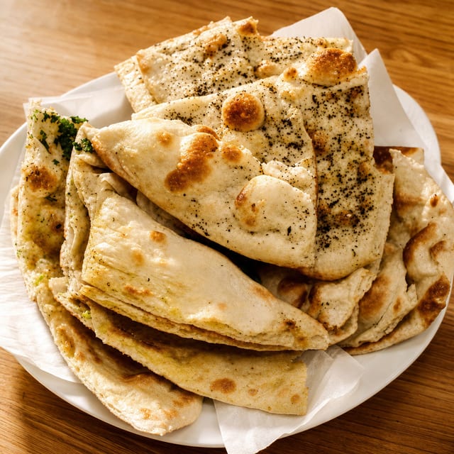 Naan Platter- (Garlic, Onion, Butter, Paneer, Aloo, Methi).