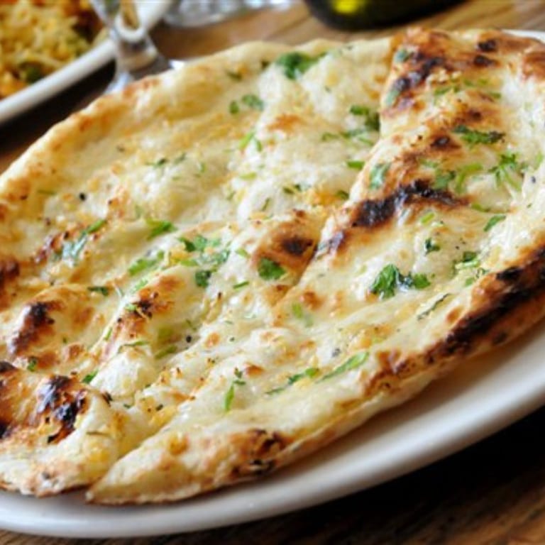 Delicious Garlic Naan and Indian Cuisine Favorites